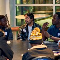 International Anchor Allies Winter 2026 First Mixer - a group in a discussion whiles seated